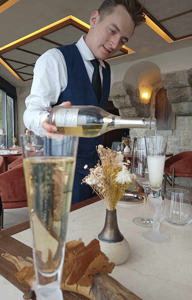 Waiter pouring Champagne