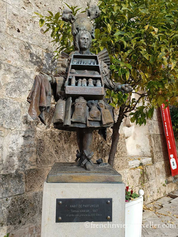Perfumer in traditional clothes; sculpture outside the International Perfume Museum
